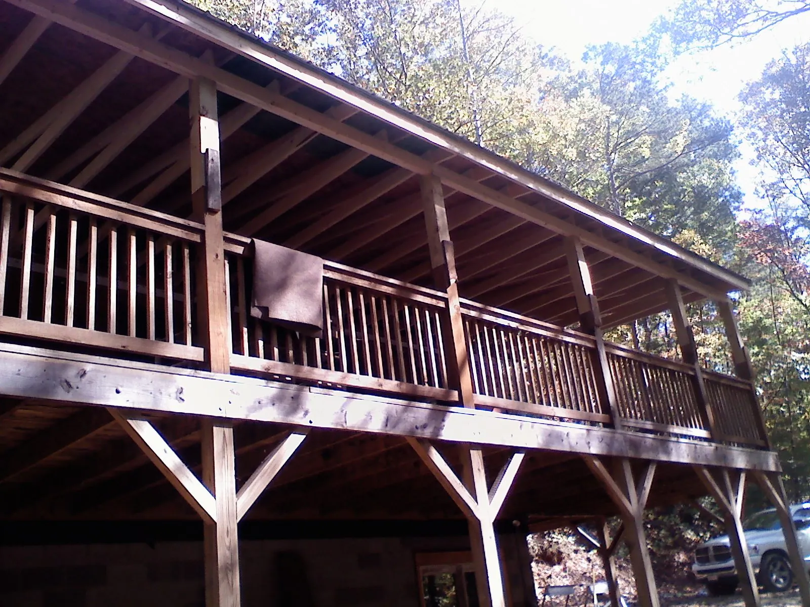 Timber framing under a new elevated porch and deck — Roof Leak Repair in Cushing by Roofing Brothers